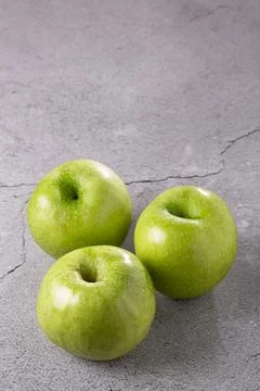 Green apples on the table. Stock Photos
