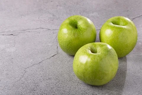 Green apples on the table. Stock Photos