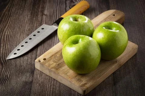 Green apples on the table. Stock Photos