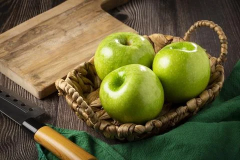 Green apples on the table. Stock Photos