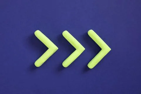 Green arrows pointing right side. Three dimensional arrow sign showing direct Stock Photos
