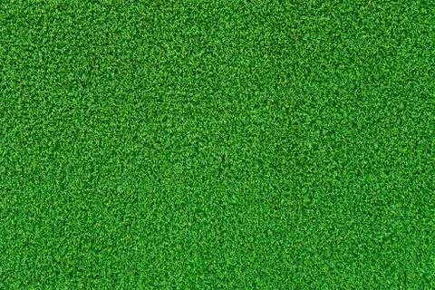 Green artificial grass surface background texture. Stock Photos