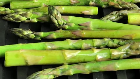 Green asparagus on grill Stock Footage 130591861