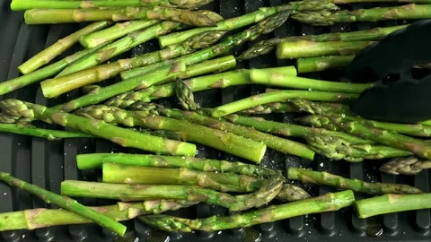 Green asparagus on grill Stock Footage 130592117