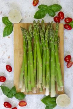 Green asparagus on a light background ready to be cooked or grilled Stock Photos