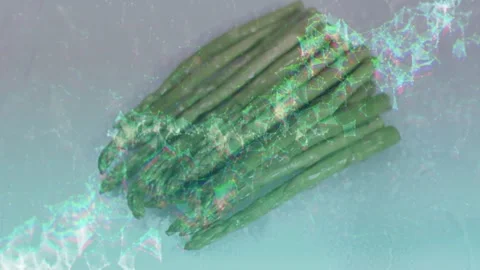 Green asparagus staying diagonal on board, overlay wave from right sweeping left Stock Footage 329908659