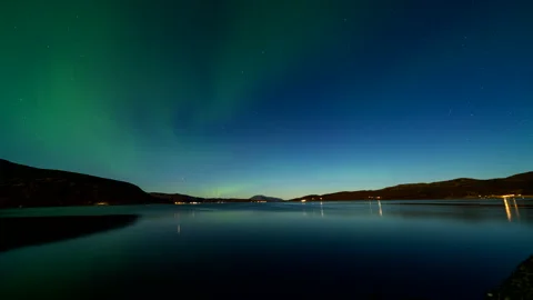 Green Aurora Borealis Reflected in Calm Fjord Water at Night - Norway Stock Footage 346323421