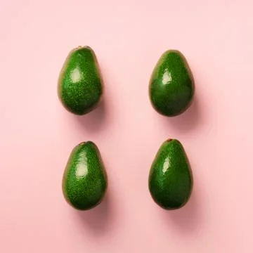 Green avocado pattern on pink background. Top view. Pop art design, creative Stock Photos