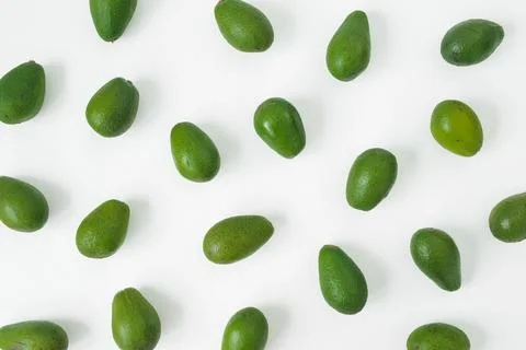 Green avocados pattern on white background, healthy food concept, minimal f.. Stock Photos