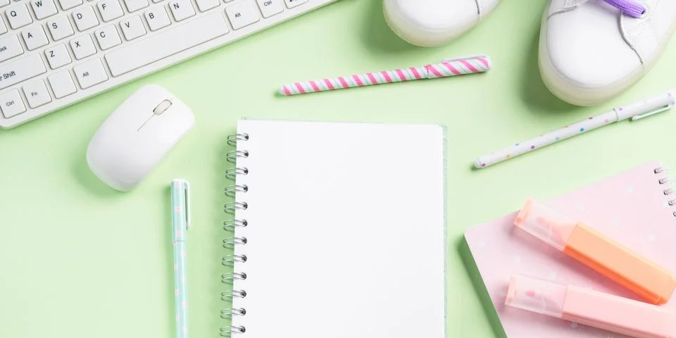 Green back to school flat lay. Workspace Stock Photos