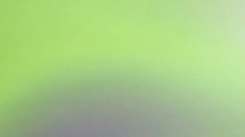 A green background with a blurry image of a person Stock Footage 313563674