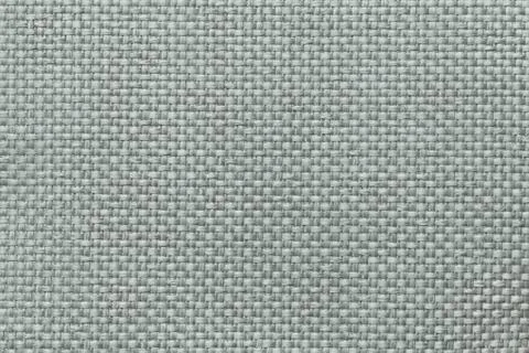 Green background with braided checkered pattern, closeup. Texture of the weav Stock Photos