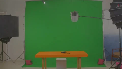 Green background for chroma shoot in studio Stock Footage 299708390