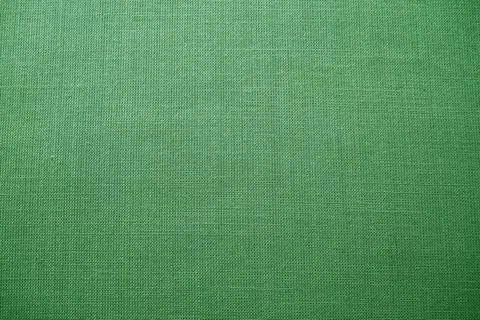Green background fabric texture. A piece of woolen cloth is neatly laid out o Stock Photos