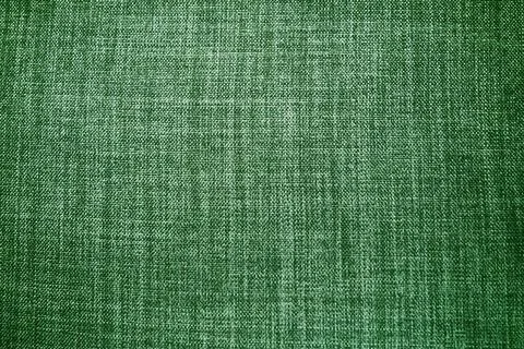 Green background fabric texture. A piece of woolen cloth is neatly laid out o Stock Photos