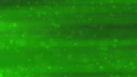 Green background features scattering particles and blurred lights Stock Footage 295726881
