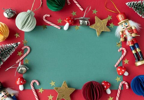 A green background with a frame and a nutcracker on it Stock Photos