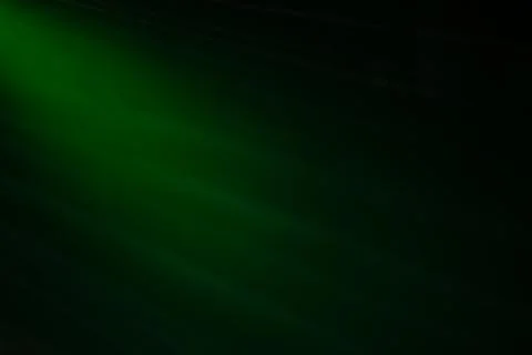 A green background with a light shining on it. The light is coming from the l Stock Photos