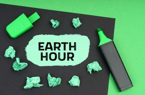On a green background, a marker, a black sheet and torn paper with the inscri Stock Photos