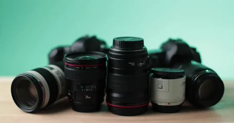 Green background name brand camera, quality equipment with modern design studio Stock Footage 237546669