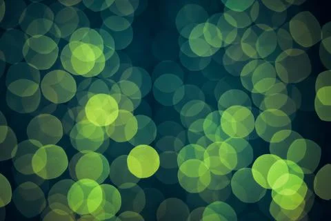 Green background with natural bokeh defocused sparkling lights. Stock Photos