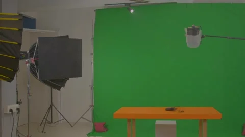 Green background set up for chroma shoot in studio Stock Footage 299708579