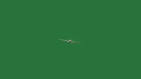 A green background with small white object and line on it screen arrow an Видео 335069102