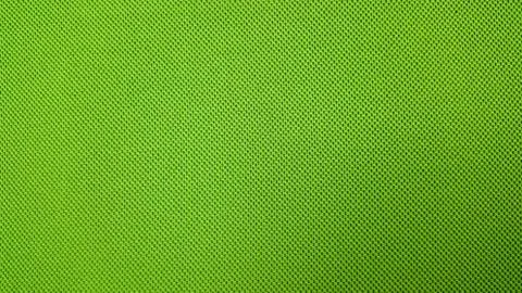 Green background textile material with pattern, closeup. Stock Photos