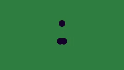 A green background with two black eyes and screen circles on it dots dot three Stock Footage 335977673