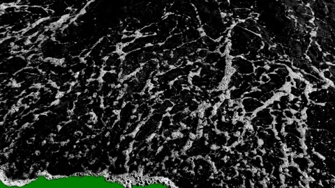 Green background white border screen lot clouds large wave aerial view ocean Stock Footage 314064560