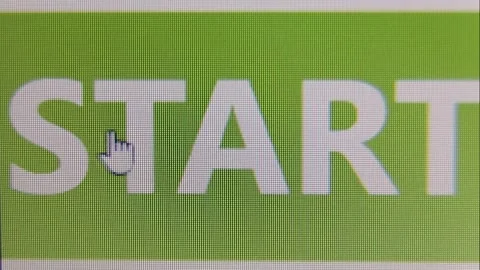 On a green background in white letters on the screen is the inscription start. Stock Footage 237513300