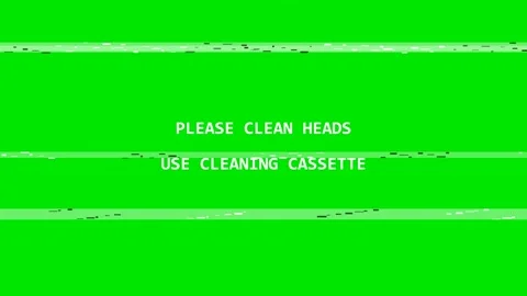 A green background with the words please clean heads and heads, use cling Video stock 346172303