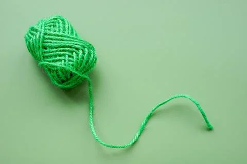 Green ball of yarn. Complexity of thoughts and interconnected ideas. Stock Photos