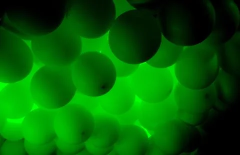 Green balloons setting a festive mood for a new years eve party Foto stock