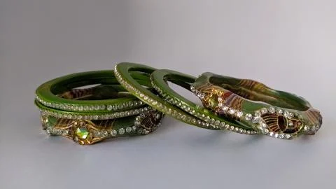 Green bangles isolated on white background - wedding  Traditional gold bangle Stock Photos