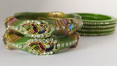 Green bangles isolated on white background - wedding  Traditional gold bangle Stock Photos
