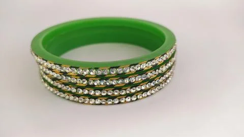 Green bangles isolated on white background - wedding  Traditional gold bangle Stock Photos