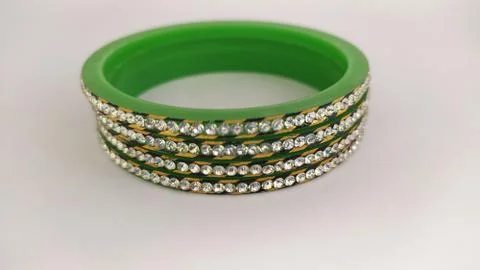 Green bangles isolated on white background - wedding  Traditional gold bangle Stock Photos