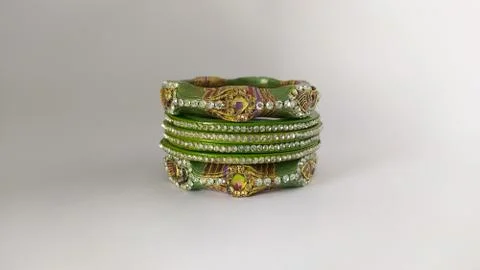 Green bangles isolated on white background - wedding  Traditional gold bangle Stock Photos