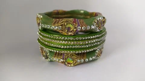 Green bangles isolated on white background - wedding  Traditional gold bangle Stock Photos