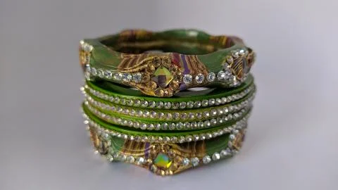 Green bangles isolated on white background - wedding  Traditional gold bangle Stock Photos