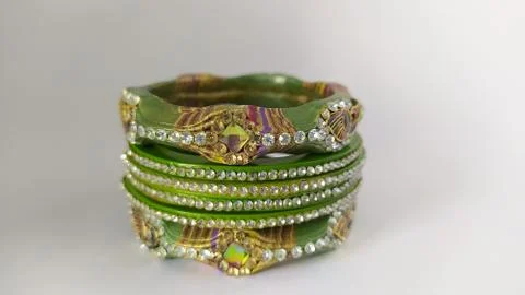 Green bangles isolated on white background - wedding  Traditional gold bangle Stock Photos