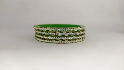 Green bangles isolated on white background - wedding  Traditional gold bangle Stock Photos
