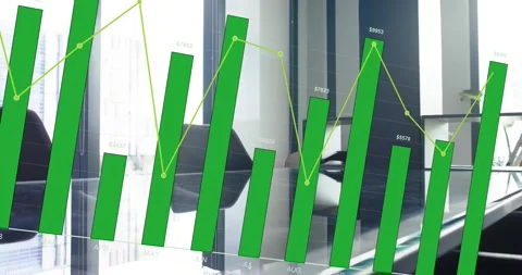 Green bar chart growing across glass table on fiscal load, showing monthly Stock Footage 334031659