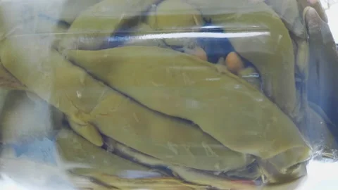GREEN BEANS canned in the jar return to the table. vertical video Stock Footage 161026063