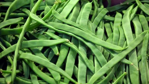 Green beans close up (market expositor). Green Texture of vegetable Stock Footage