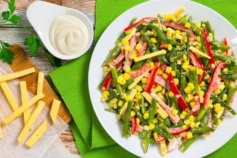 Green beans, corn, ham and cheese salad Stock Photos
