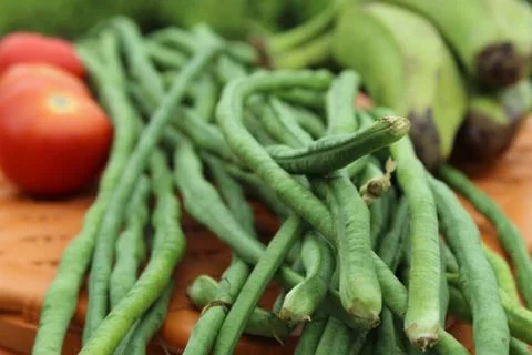 Green beans display with selective focus and fresh various raw organic vegetable 库存照片