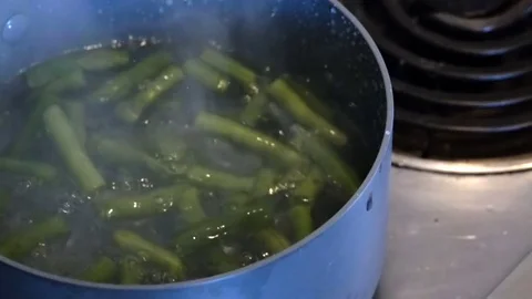 Green Beans Falling Into Boiling Water Video stock 77024726