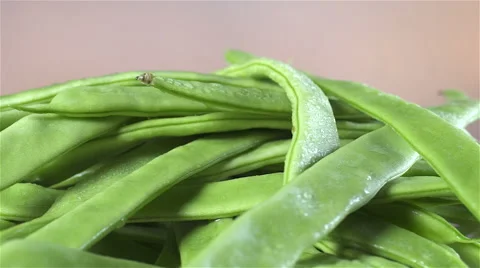 Green Beans isolated rotating on brown/gray background Stock Footage 62295504